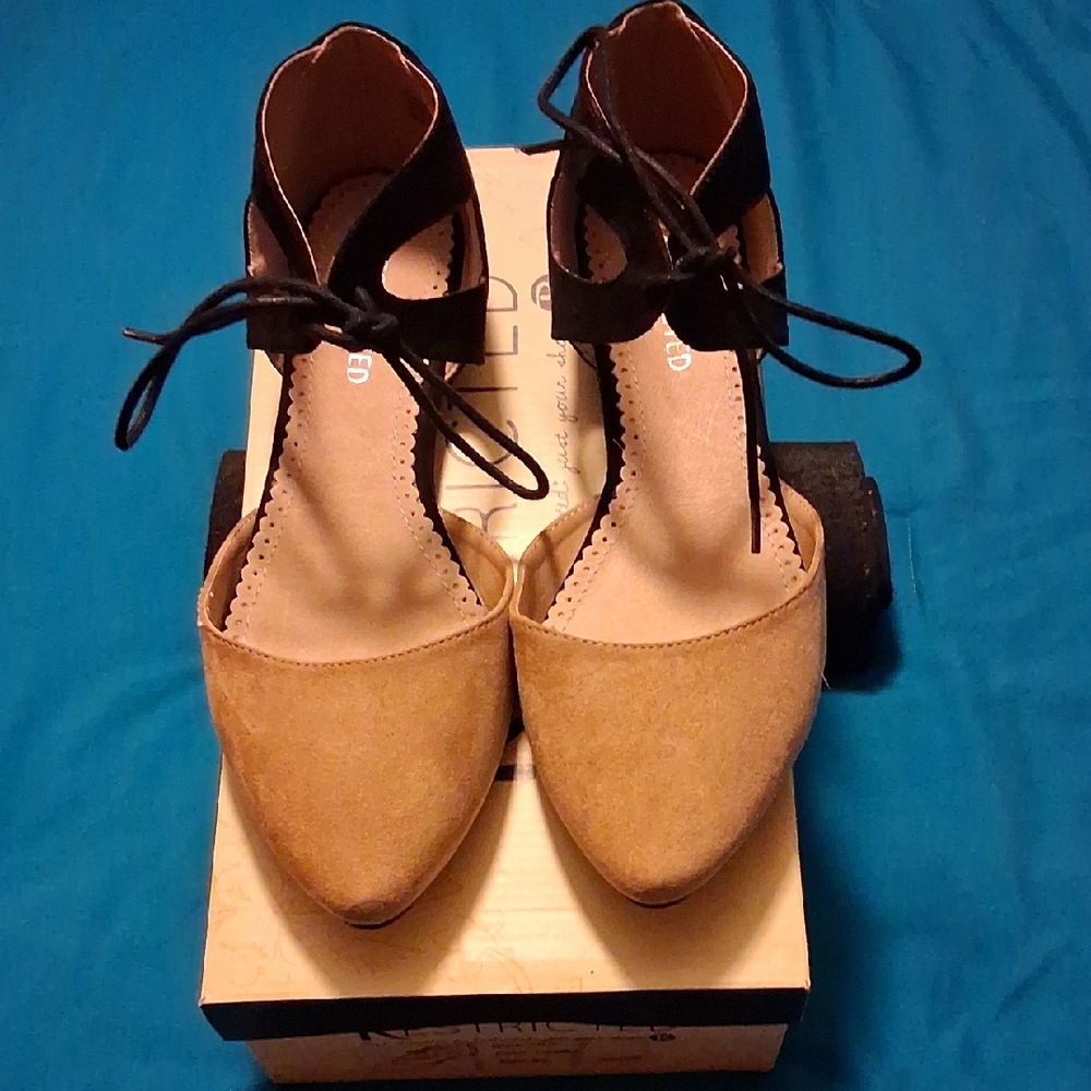 Restricted Tan and Black Pointed-Toe Ankle Tie Heels